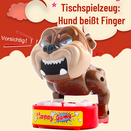 Tischspielzeug: Hund beißt Finger