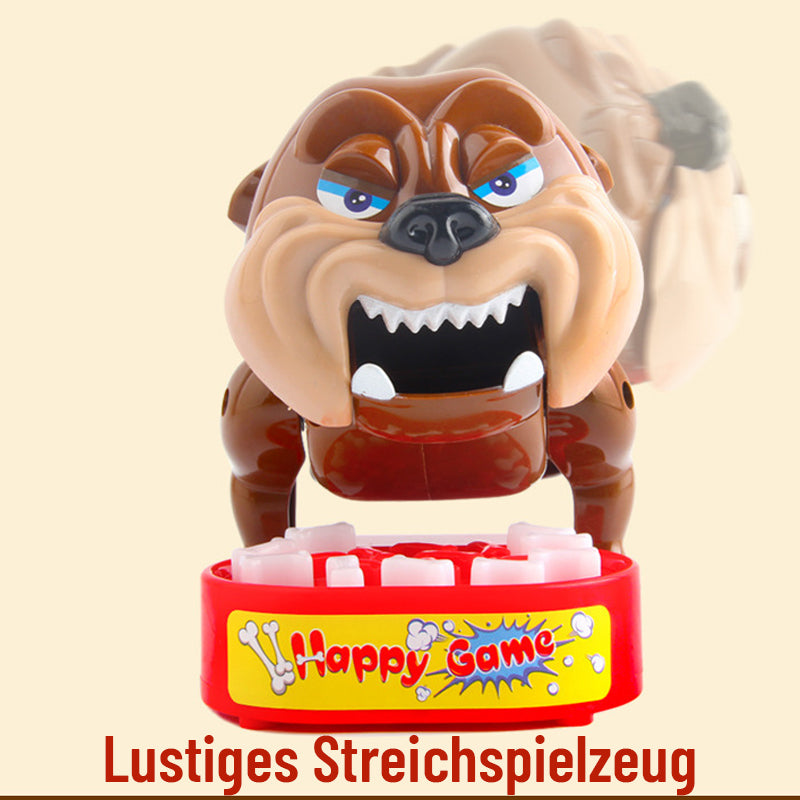 Tischspielzeug: Hund beißt Finger