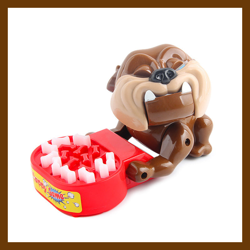 Tischspielzeug: Hund beißt Finger